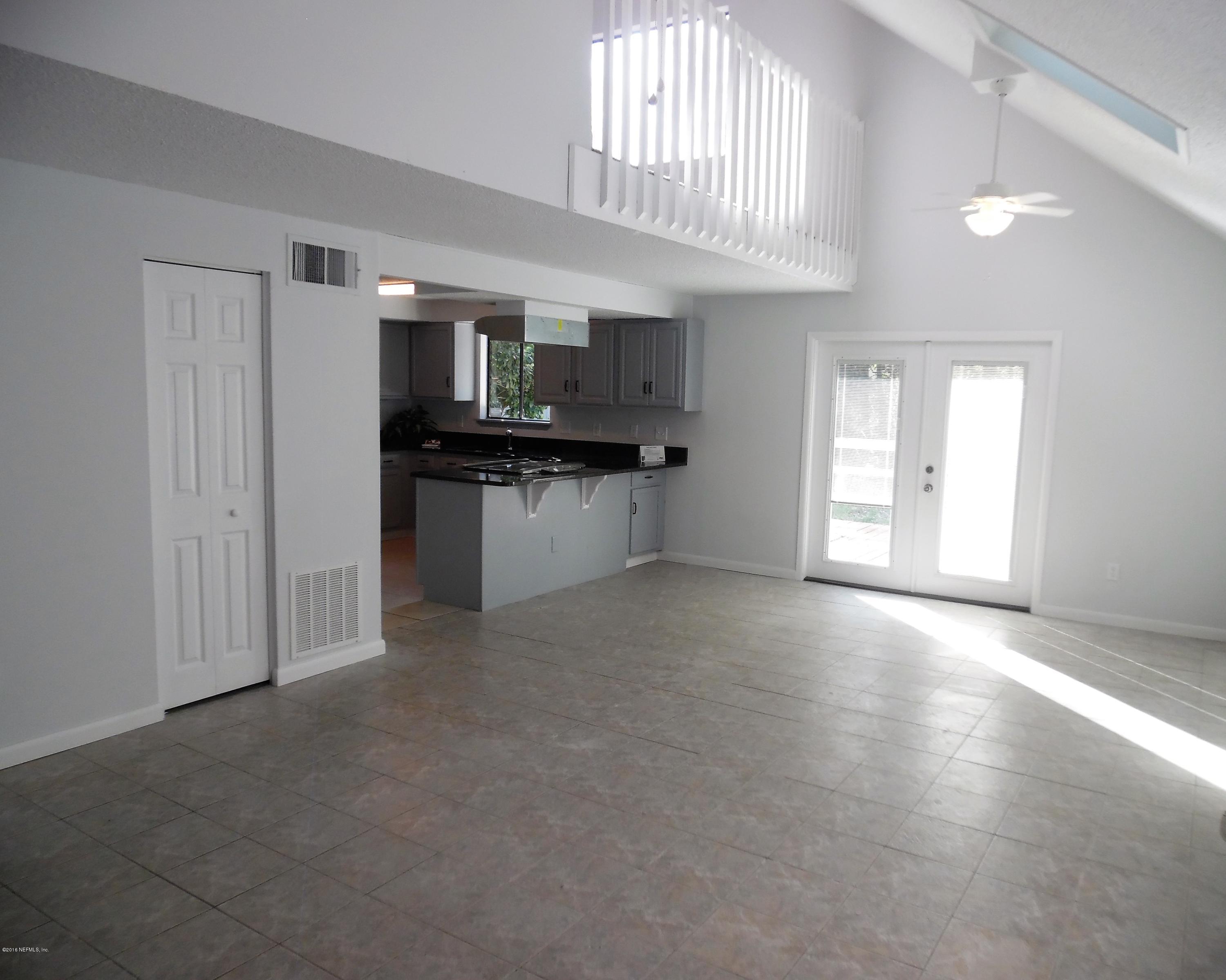 10244 Pine Breeze Road South Jacksonville, FL 32257 - Photo 24 of 27 a view of a kitchen with a sink cabinets and a window