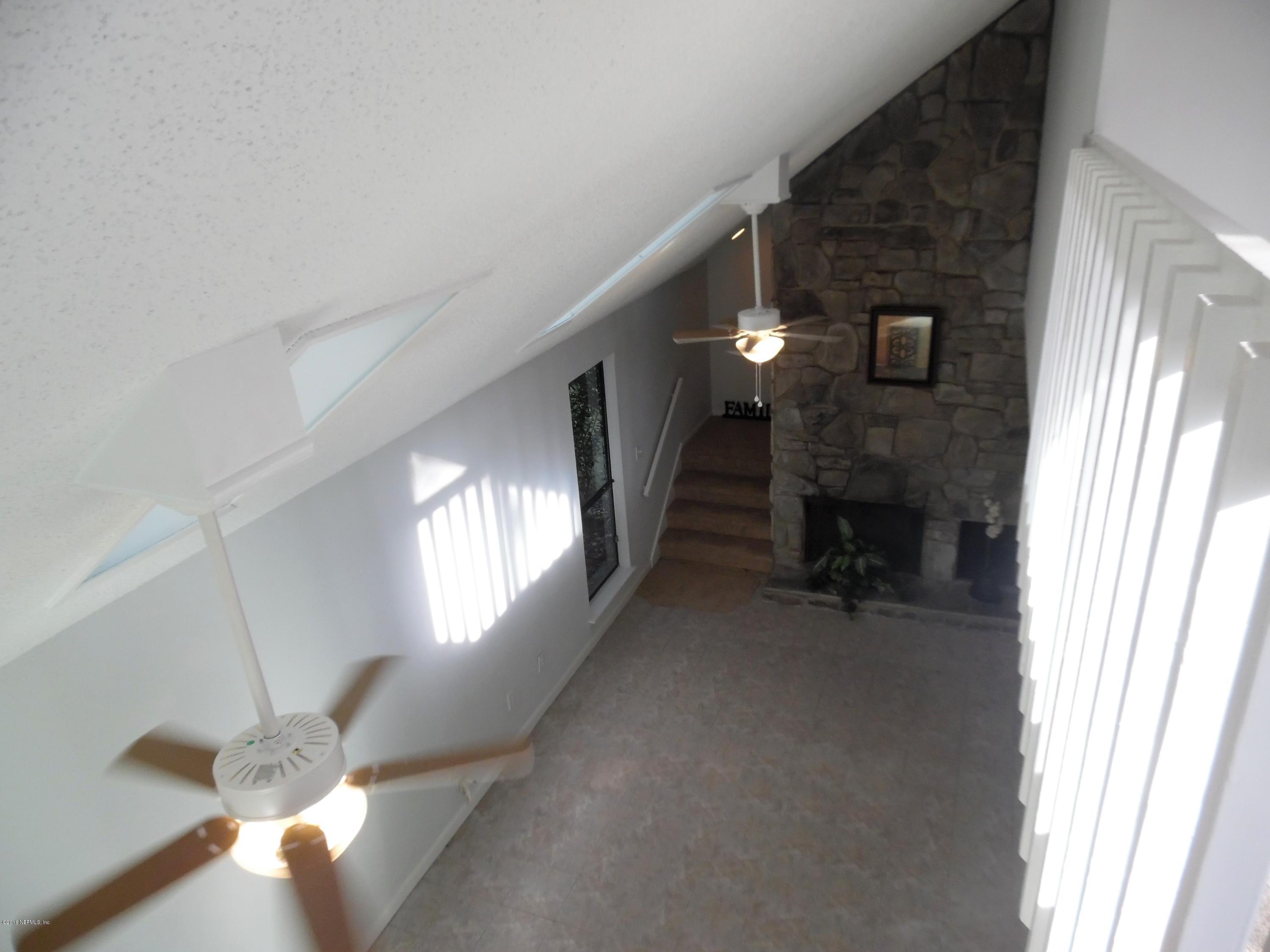 10244 Pine Breeze Road South Jacksonville, FL 32257 - Photo 25 of 27 a view of entryway and hall with a window