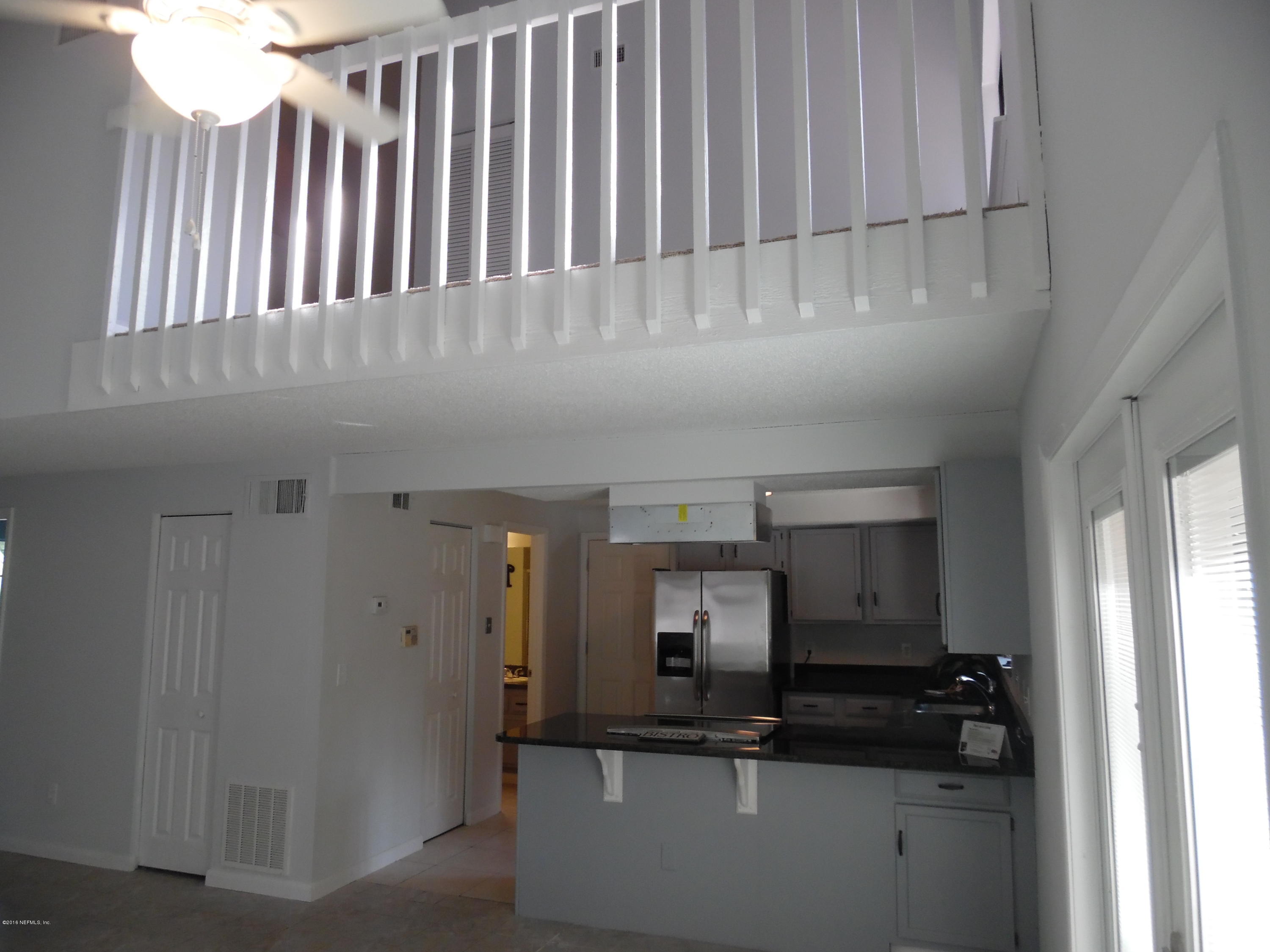 10244 Pine Breeze Road South Jacksonville, FL 32257 - Photo 27 of 27 a kitchen with kitchen island granite countertop a sink and cabinets