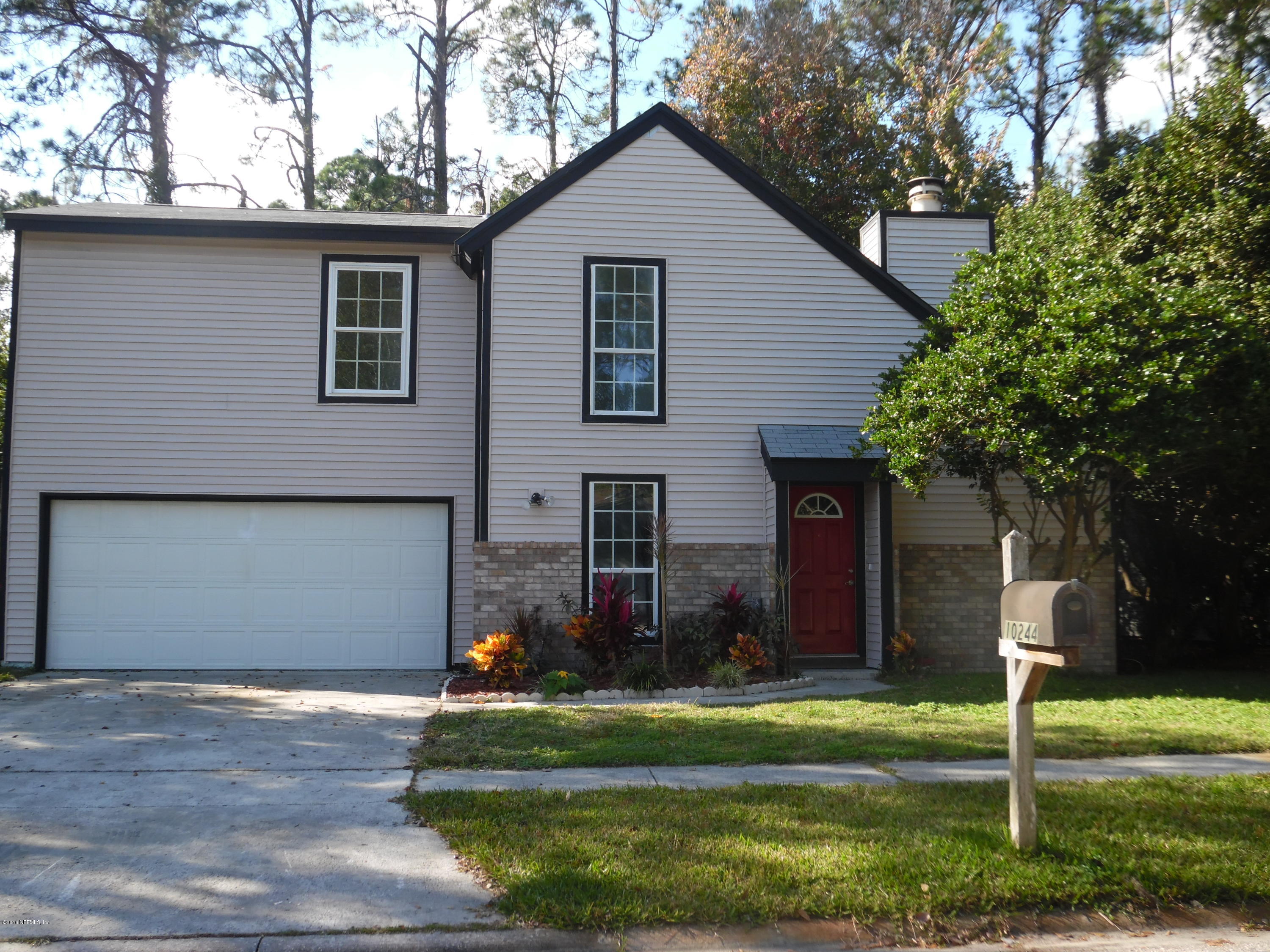 10244 Pine Breeze Road South Jacksonville, FL 32257 - Photo 26 of 27 a front view of a house with garden