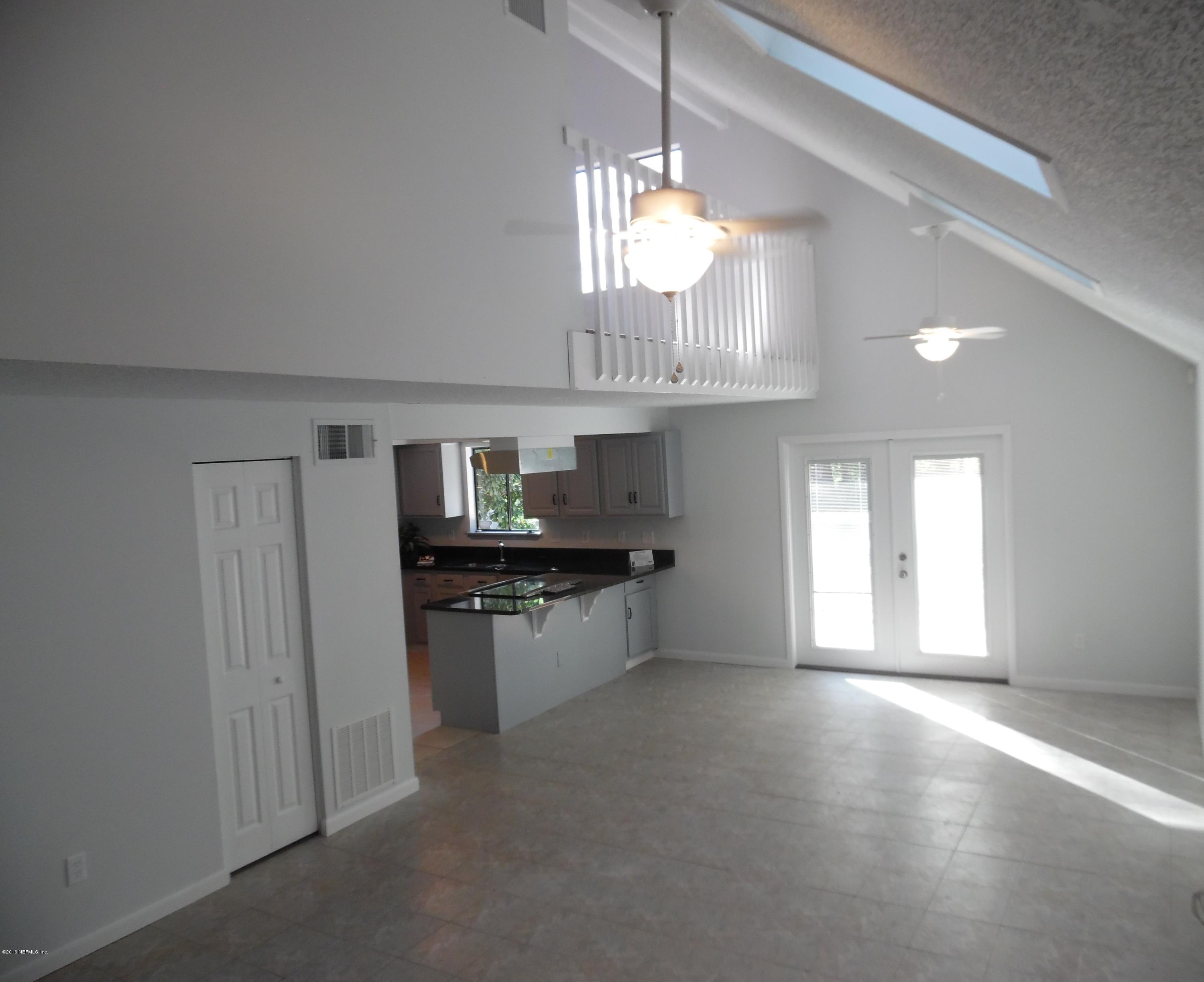 10244 Pine Breeze Road South Jacksonville, FL 32257 - Photo 4 of 27 a kitchen with stainless steel appliances granite countertop a stove a sink dishwasher and a refrigerator with wooden floor
