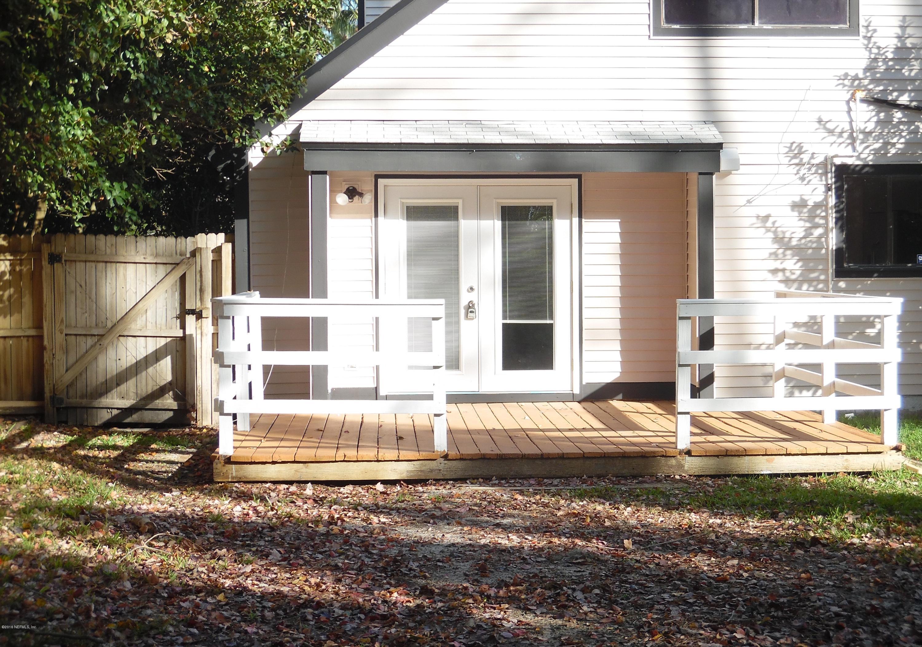 10244 Pine Breeze Road South Jacksonville, FL 32257 - Photo 6 of 27 a view of a house with a door and a window