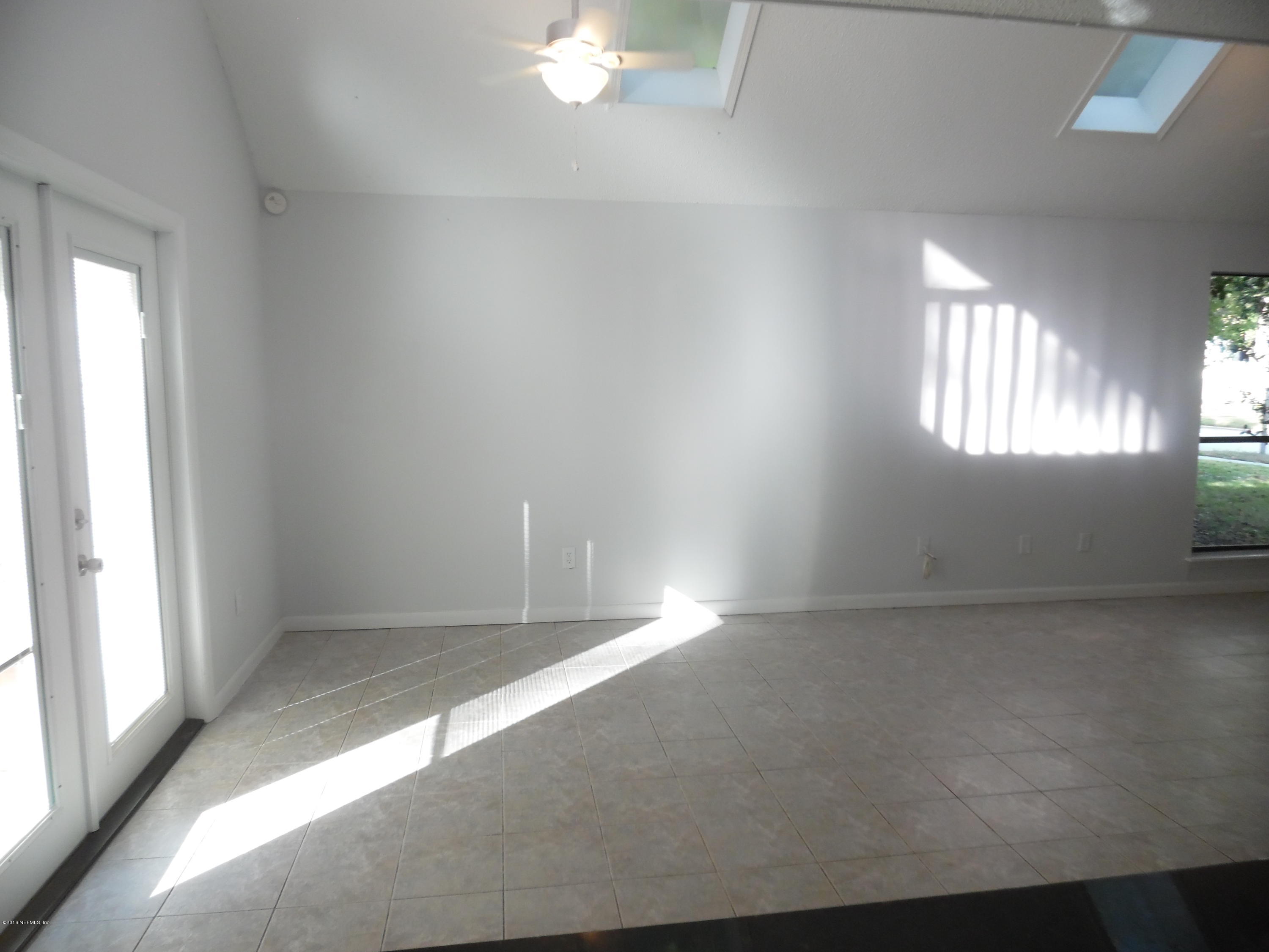 10244 Pine Breeze Road South Jacksonville, FL 32257 - Photo 9 of 27 an empty room with windows