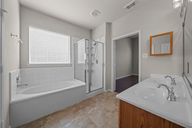 a white bath tub sitting next to a white sink