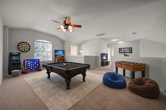 6047 Northcrest Village Way Spring, TX 77388 - Photo 17 of 30 a living room with furniture a table and window