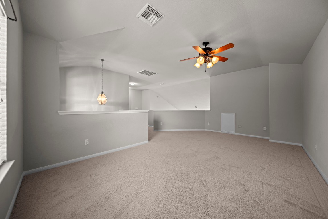 6047 Northcrest Village Way Spring, TX 77388 - Photo 18 of 30 an empty room with windows and fan