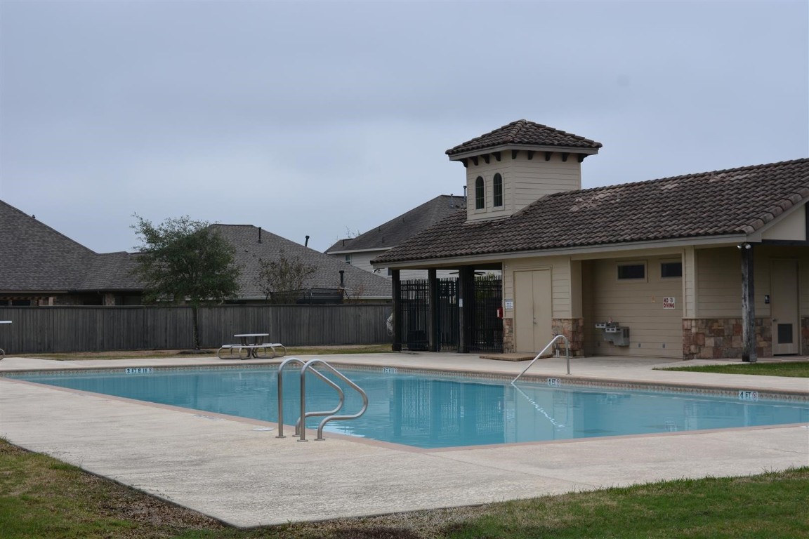 6047 Northcrest Village Way Spring, TX 77388 - Photo 28 of 30 a view of a house with a swimming pool