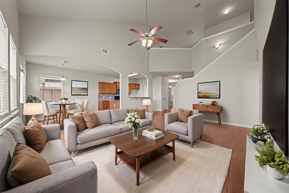 6047 Northcrest Village Way Spring, TX 77388 - Photo 7 of 30 a living room with furniture ceiling fan and a rug