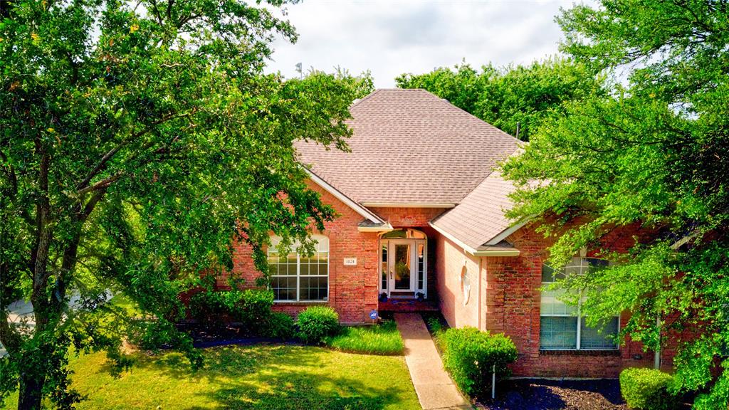 1124 Shell Beach Drive Little Elm, TX 75068 - Photo 1 of 1 a front view of a house with garden