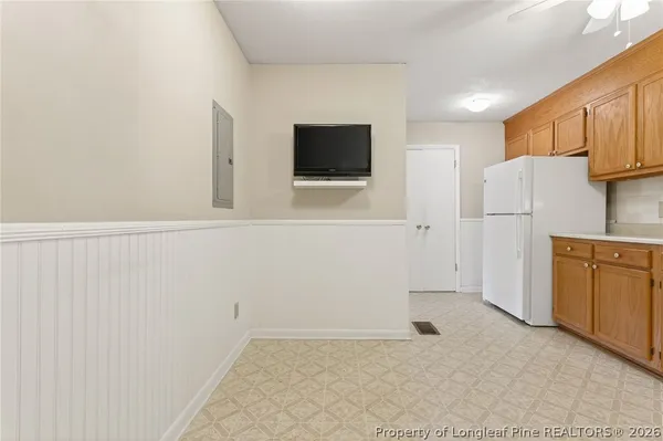 a view of kitchen with furniture and wooden floor