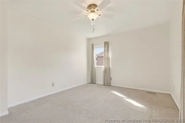 a view of a chandelier fan in a room