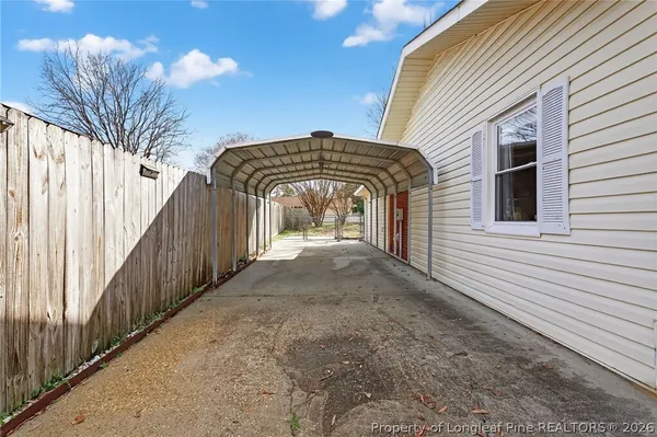 a front view of a house with parking space