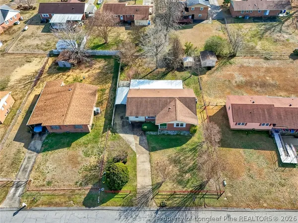 an aerial view of residential houses with outdoor space