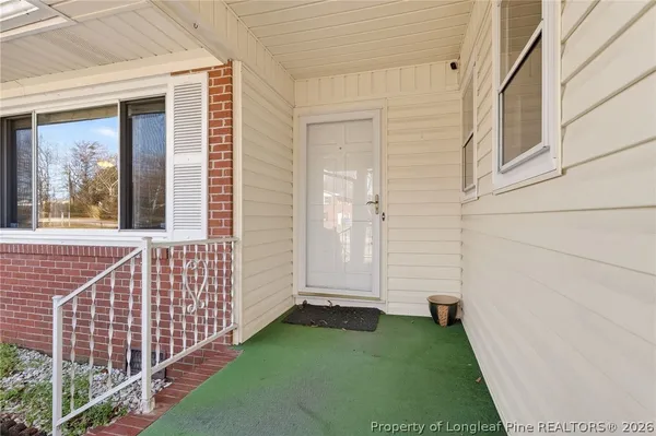 a view of a porch with a yard