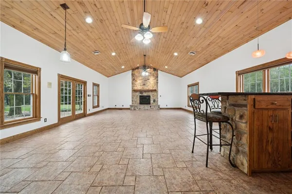 a view of a livingroom with furniture a dinning room and stairs