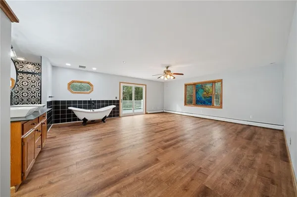 a view of an empty room and a window