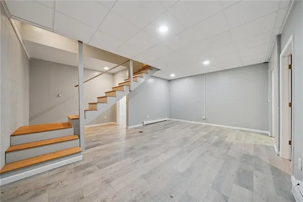 a view of entryway with stairs and wooden floor
