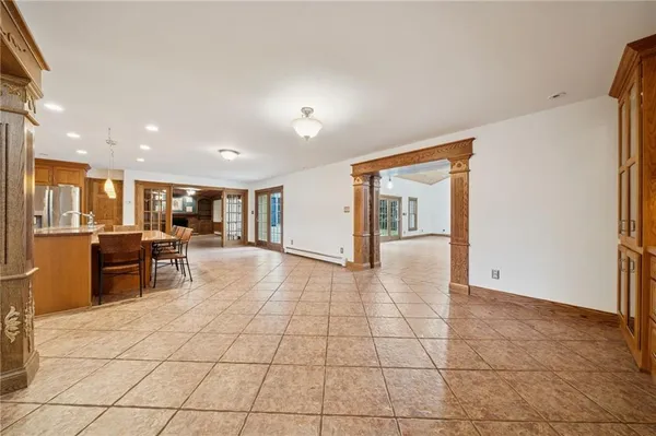 a view of kitchen with furniture and refrigerator