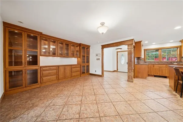 a view of a entryway with furniture and cabinet