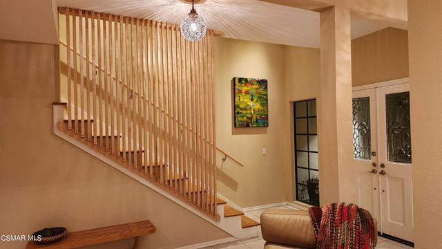 a kitchen with stainless steel appliances kitchen island granite countertop a sink and cabinets