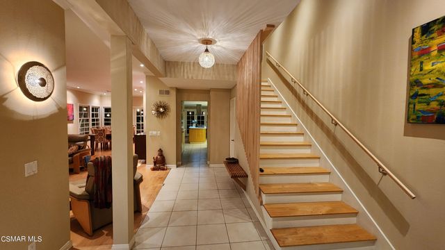 a kitchen with stainless steel appliances a stove a refrigerator and a sink
