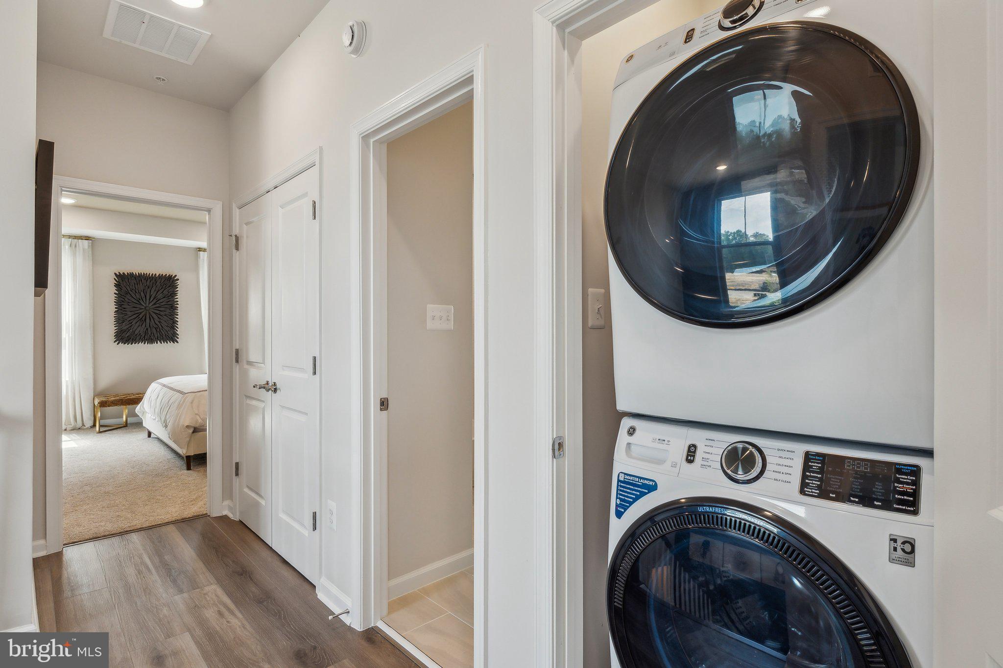 7014 Gladebrook Road Brandywine, MD 20613 - Photo 25 of 43 a view of a hallway with washer and dryer
