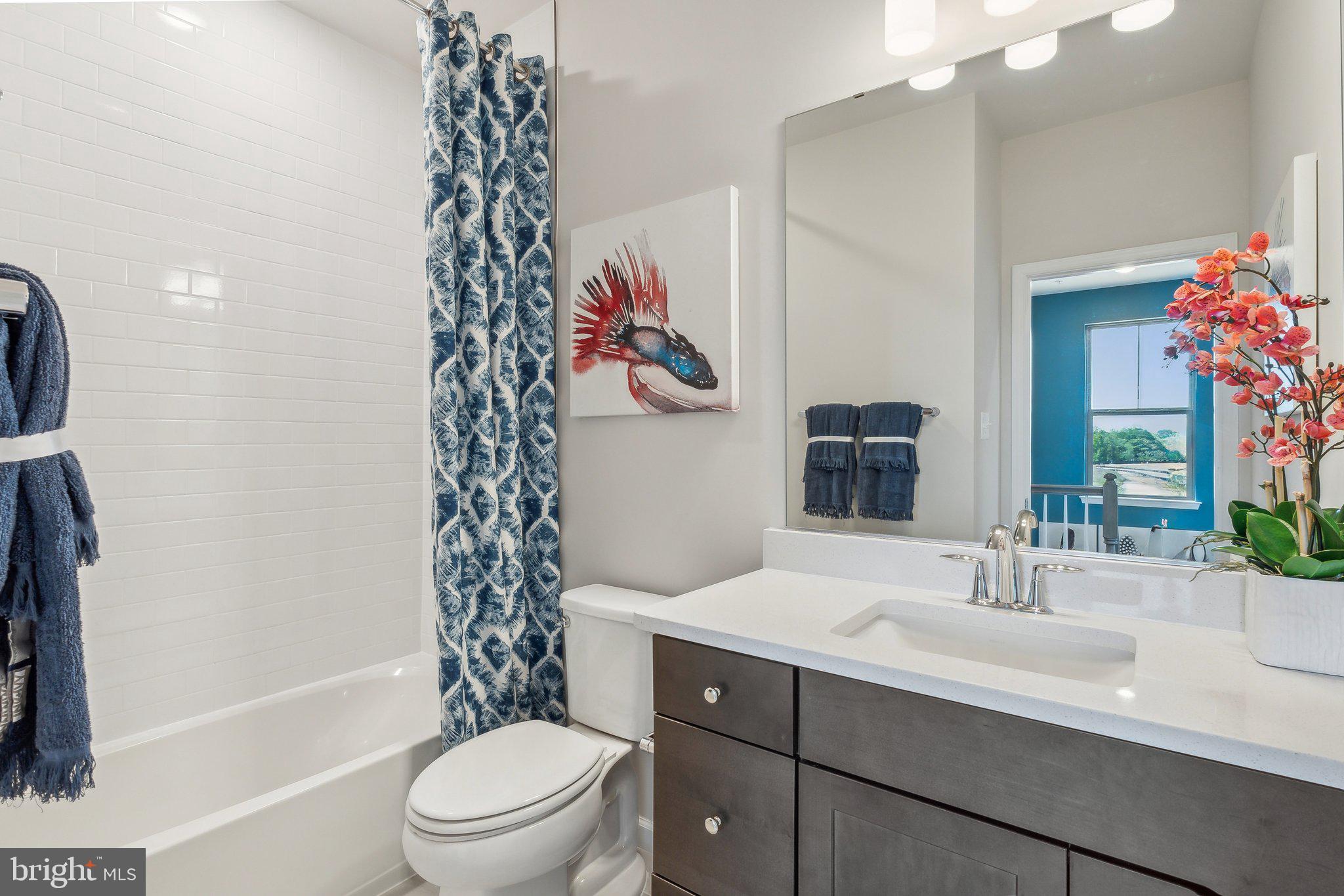 7014 Gladebrook Road Brandywine, MD 20613 - Photo 26 of 43 a bathroom with a sink a toilet and shower