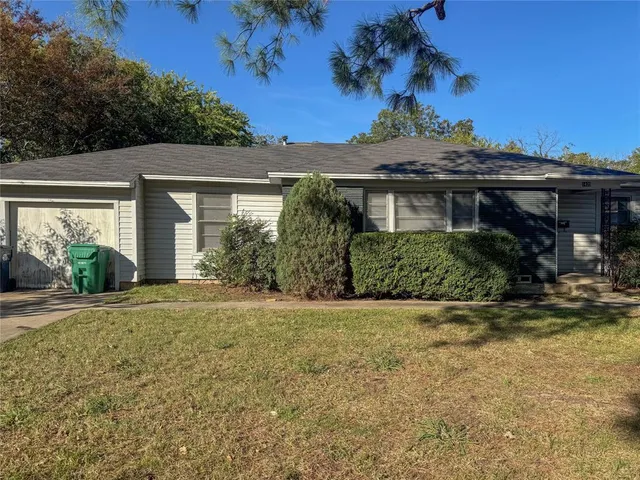 front view of a house with a garden