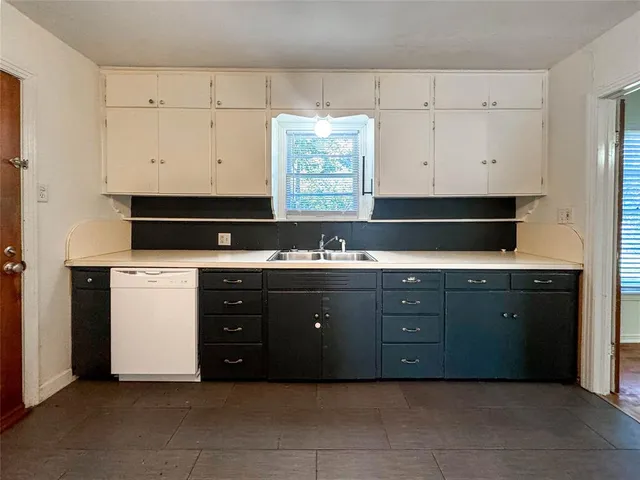 a kitchen with a cabinets and a stove