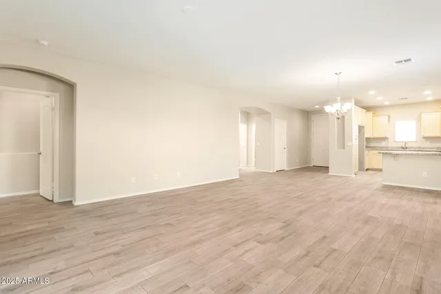 a view of a kitchen with a sink and a refrigerator