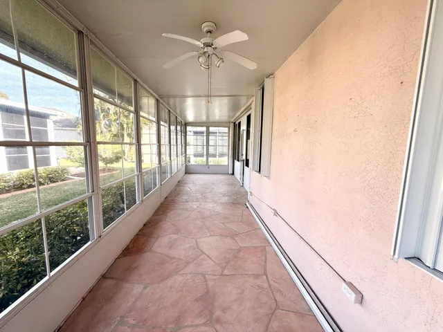a view of an empty room with a large window