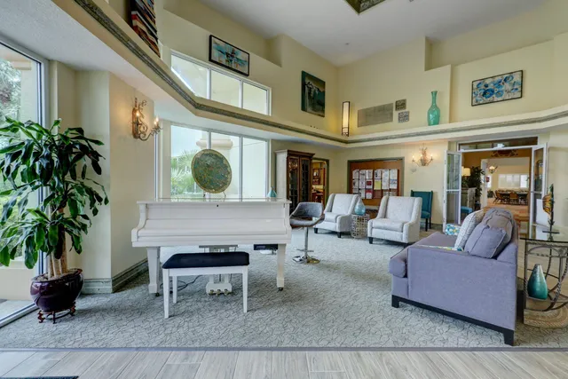 an aerial view of a residential apartment building with a yard