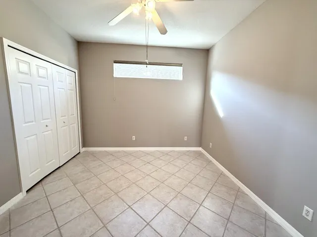 a kitchen with a sink a refrigerator and window