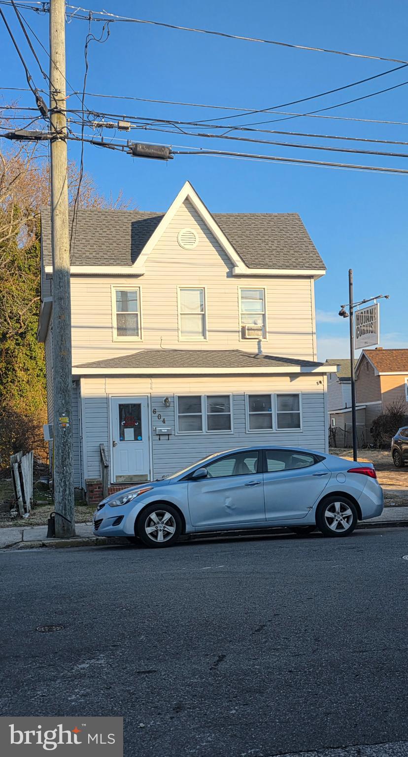 604 Pine Street Cambridge, MD 21613 - Photo 1 of 15 a car parked in front of a house