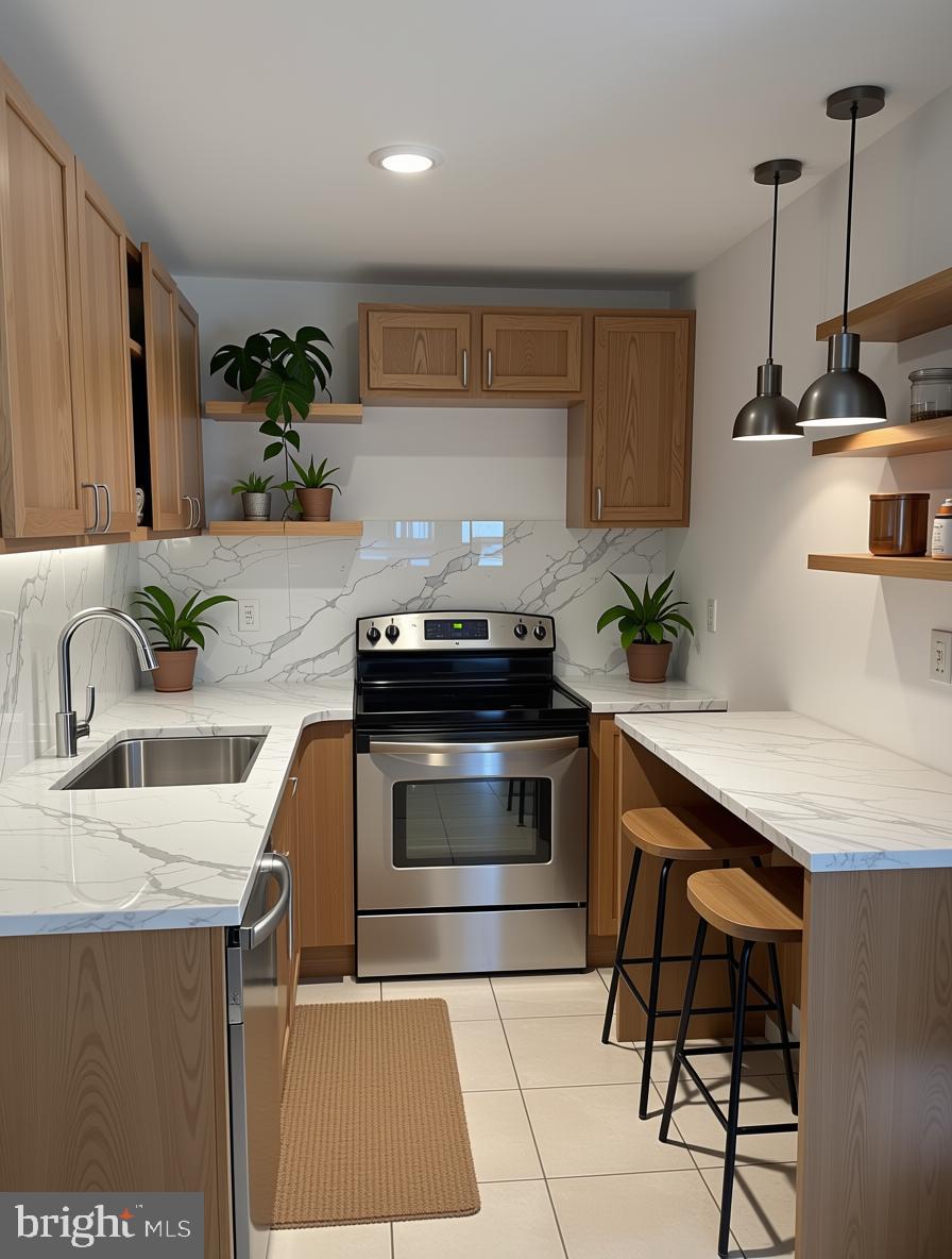 604 Pine Street Cambridge, MD 21613 - Photo 5 of 15 a kitchen with granite countertop a sink and stove top oven