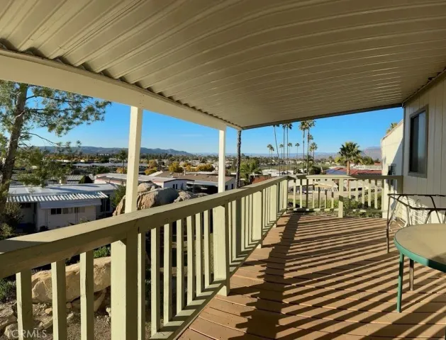 a view of a chairs and table in patio