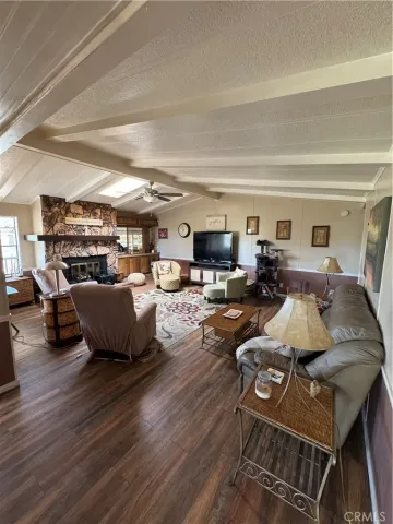 a bedroom with a bed and a dresser next to a window