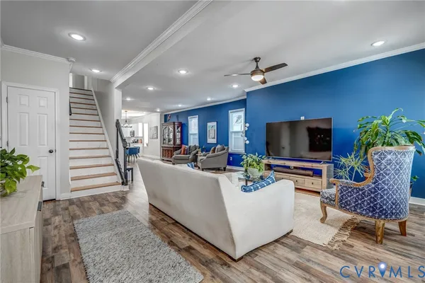 a view of a dining room with furniture window and wooden floor