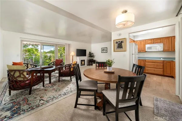 a view of a dining room with furniture and window