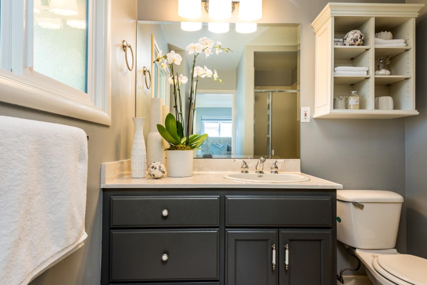 115 Chukker Court San Mateo, CA 94403 - Photo 11 of 23 a bathroom with a double vanity sink toilet and a mirror