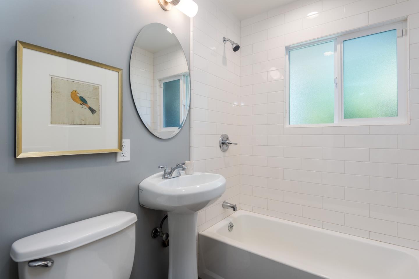 115 Chukker Court San Mateo, CA 94403 - Photo 13 of 23 a bathroom with a toilet sink and mirror
