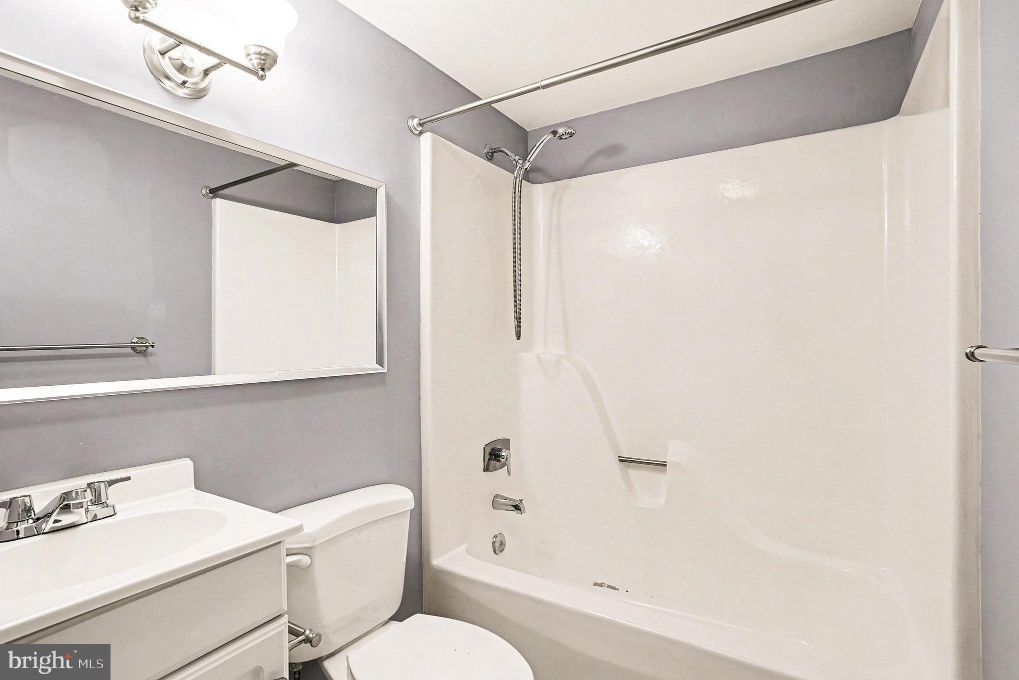 85 Railroad Avenue Glyndon, MD 21071 - Photo 13 of 28 a bathroom with a shower a toilet and a sink