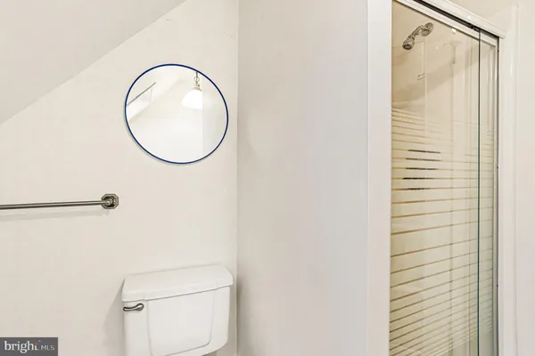 a bathroom with a toilet and a white sink