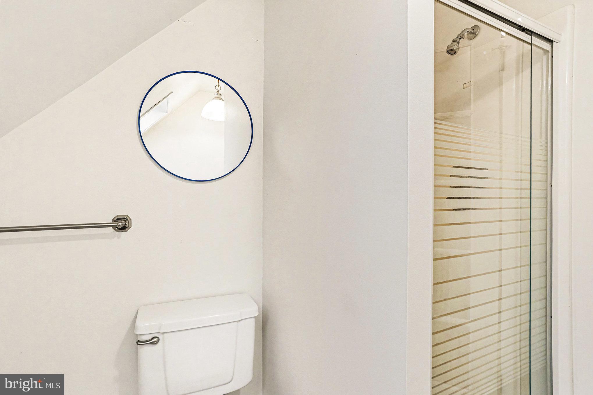 85 Railroad Avenue Glyndon, MD 21071 - Photo 18 of 28 a bathroom with a toilet and a white sink