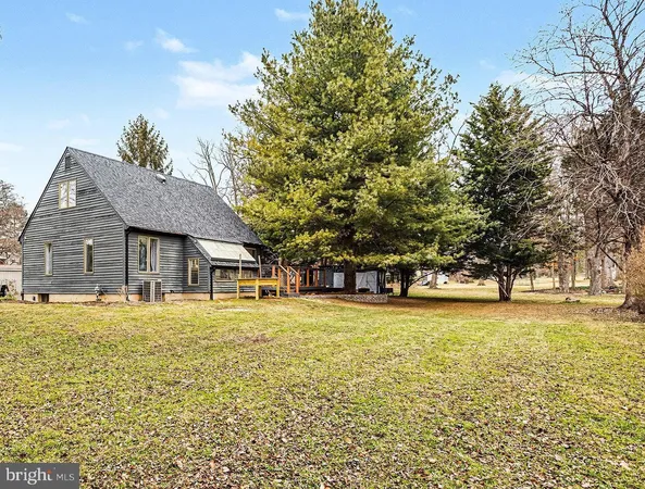 a front view of house with yard and trees