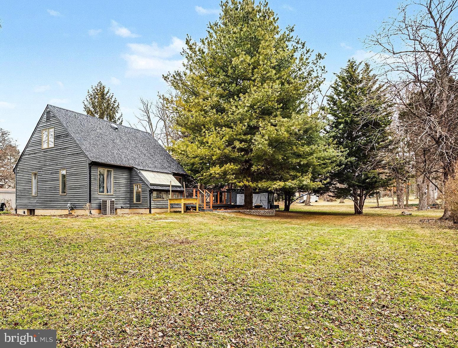 85 Railroad Avenue Glyndon, MD 21071 - Photo 2 of 28 a front view of house with yard and trees