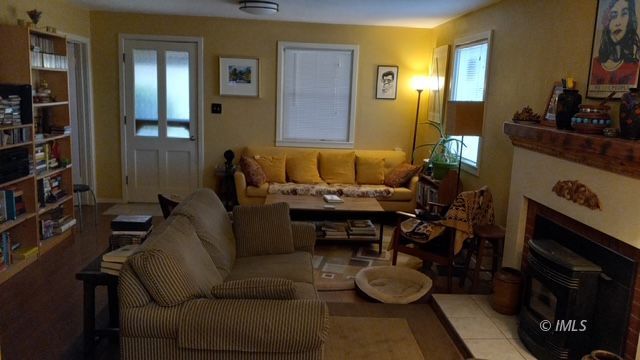 103 North Clay Street Independence, CA 93526 - Photo 13 of 25 a living room with furniture and a fireplace
