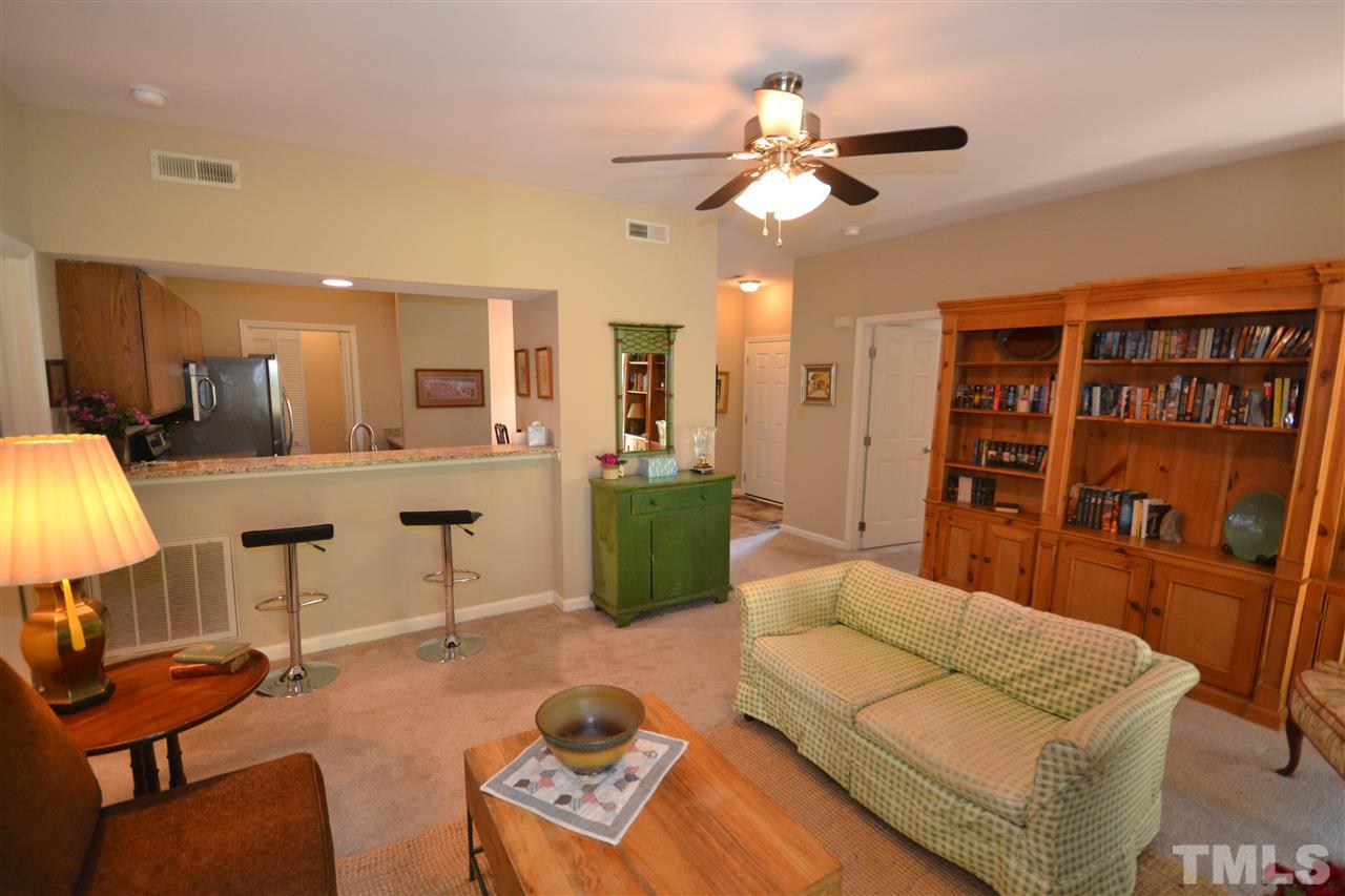 6151 Summer Pointe Place, Unit 103 Raleigh, NC 27606 - Photo 1 of 12 Large family room has plenty of room for entertaining.