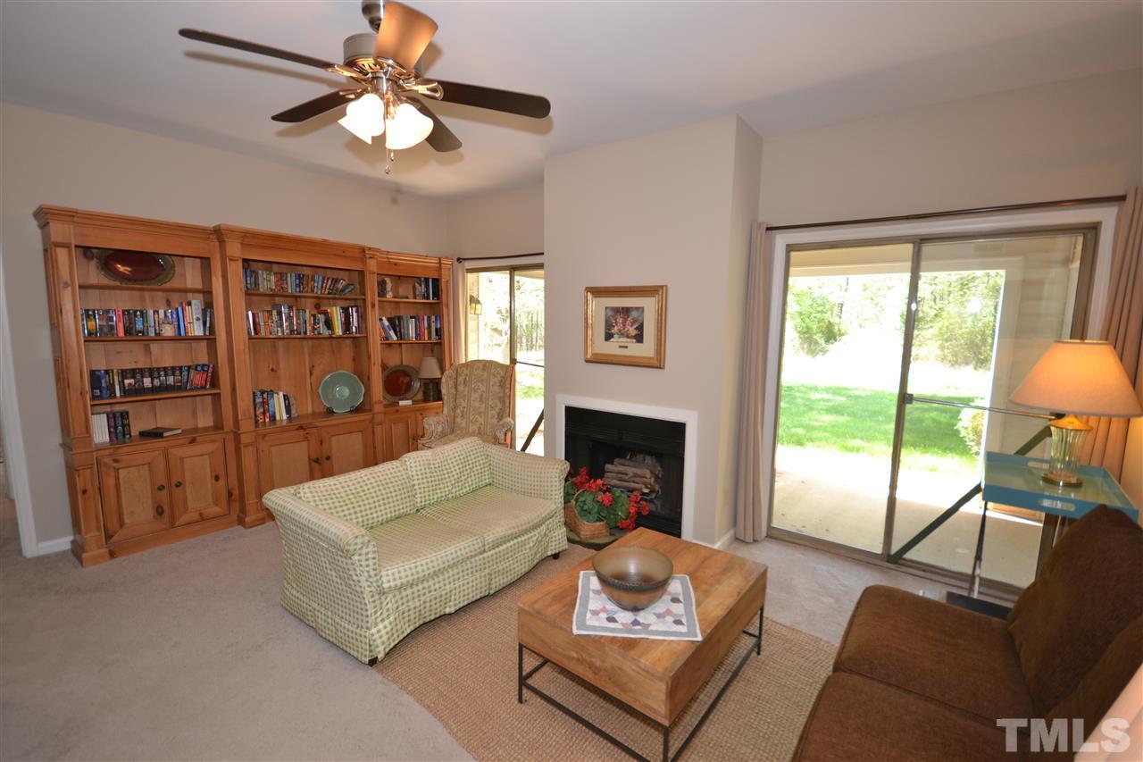 6151 Summer Pointe Place, Unit 103 Raleigh, NC 27606 - Photo 2 of 12 Two sliding glass doors lead to a patio and side yard. Lots of natural light!
