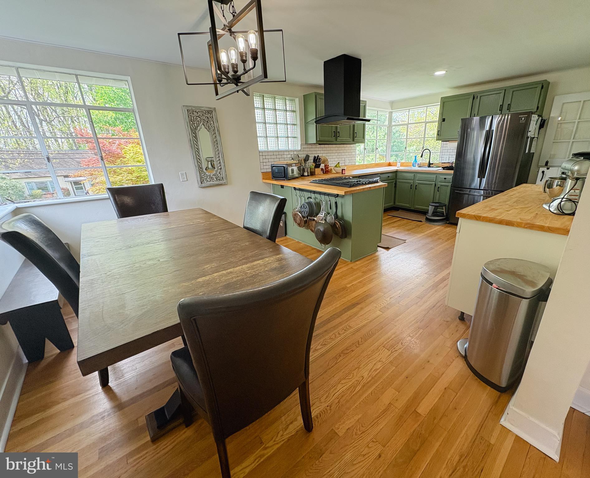 1947 Sand Hill Road Hershey, PA 17033 - Photo 2 of 16 a dining room with furniture a chandelier and wooden floor